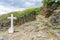 white stone religious crucifix in the uninhabited village of Drave, the most isolated in Portugal.