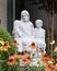 White stone statue of Saint Joseph with two children at Saint Joseph Catholic School in Arlington, Texas.