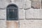 White stone wall with mail box