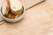 white stoneware bowl with fresh organic sliced bread on a rustic wooden surface