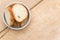 white stoneware bowl with fresh organic sliced bread on a rustic wooden surface