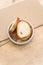 white stoneware bowl with fresh organic sliced bread on a rustic wooden surface