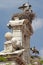 White storks in their nests on the bulrush of the chapell of san ildefonso