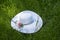 White straw women`s hat Headdress for the beach.