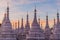 White stupas around Sandamuni (Sandamani or Sandar Mu Ni) pagoda during dusk in Mandalay, Myanm