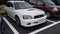 A white Subaru Legacy GT-B station wagon touring with E-tune package in a parking lot