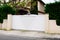 White suburban metal modern gate white fence on home suburb street access house garden