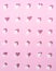 White sugar hearts and cubes on a hand-arranged asymmetric pattern with pastel pink background and sharp 3d shadows.