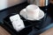 White sugar packet with coffee cup and kettle set in hotel room