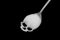 White sugar in skull shape spoon, concept idea is risk of Diabetes mellitus