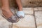White summer sandals for kids on a brick ground typical from Menorca