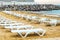 White sunbed on the sand beach at the sea, summer sea rest concept