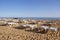 White sunbeds on a sandy beach