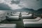 White sunbeds stand on the pier. Nice pier. Sea coast. Mountains in the background.