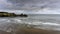 White surf and clouds at Three Cliffs Bay South Wales