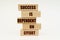 On a white surface are wooden blocks with the inscription - SUCCESS IS DEPENDENT ON EFFORT