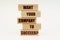 On a white surface are wooden blocks with the inscription - WANT YOUR COMPANY TO SUCCEED