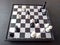 White surrendered. The victory of black pieces