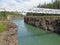 White suspension bridge across Miles Canyon Yukon