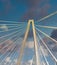 White Suspension Bridge Into Blue Skies