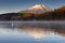 White swan floating on lake with Mountain Fuji in background at yamanaka lake ,
