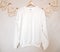 White sweatshirt mockup on a hanger. Blank hoodie mockup with boho backgrounds.