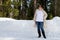 White sweatshirt mockup of a woman wearing black snow boots