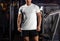 White t-shirt mockup on a man in the gym, sportswear for design presentation, brand, front view