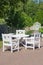 White table and chairs outdoor, walkway perspective