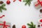 White table with Christmas decorations and space in the middle for text. Christmas composition with gifts, fir branches, lollipop,