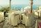 White tables and chairs in greek cafe by the sea coast, Crete, G