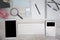 White Tablet With Blank Screen, laptop and accessories and office stuff On Wooden Desk With Stationary Objects , Top View,Travel c