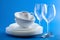 White tableware over blue background