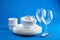 White tableware over blue background