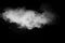 White talcume powder explosion on black background. White dust particles splash