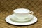 White teacup with saucer