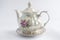 White teapot painted with rose