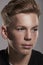 White teenage boy looking away, close up portrait, vertical