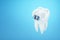 White teeth with metal braces on a blue background. Dental braces, orthodontic treatment, dentistry, teeth whitening, protection,