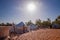 White tents in the camp of the desert Lompoul, Senegal, Africa. The sun is shinning on the sand