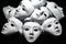 White theater masks on black background. Abstract.