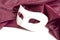 White theatrical mask and silk fabric