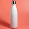 White Thermal bottle on a pink background. Thermos bottle