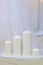 White thick wax candles group in row