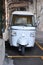 white three wheeled car in th narrow streets of Scilla, Calabria