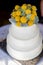 White tiered wedding cake at a wedding reception