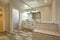 White tile and dark wood floors in open clean bathroom model home San Diego southern California real estate shoot