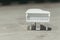 White tiny wooden piano on a wooden surface