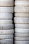 White tires. Stack of car tyres painted white. Automobile background image.