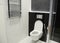 White toilet bowl with thermostatic electric towel rail for bath